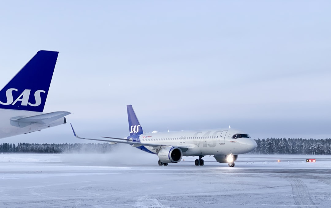 a large jetliner sitting on top of an airport tarmac,