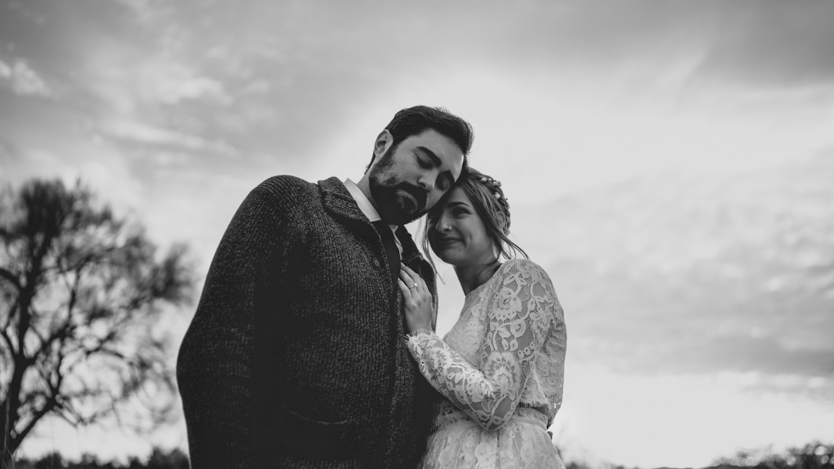 A husband and wife smiling together