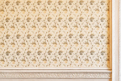 Traditional brass wall hanging featuring detailed floral patterns.
