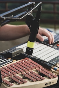 a person is using a microphone to record music