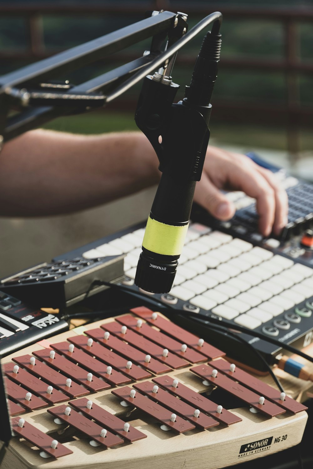 a person is using a microphone to record music