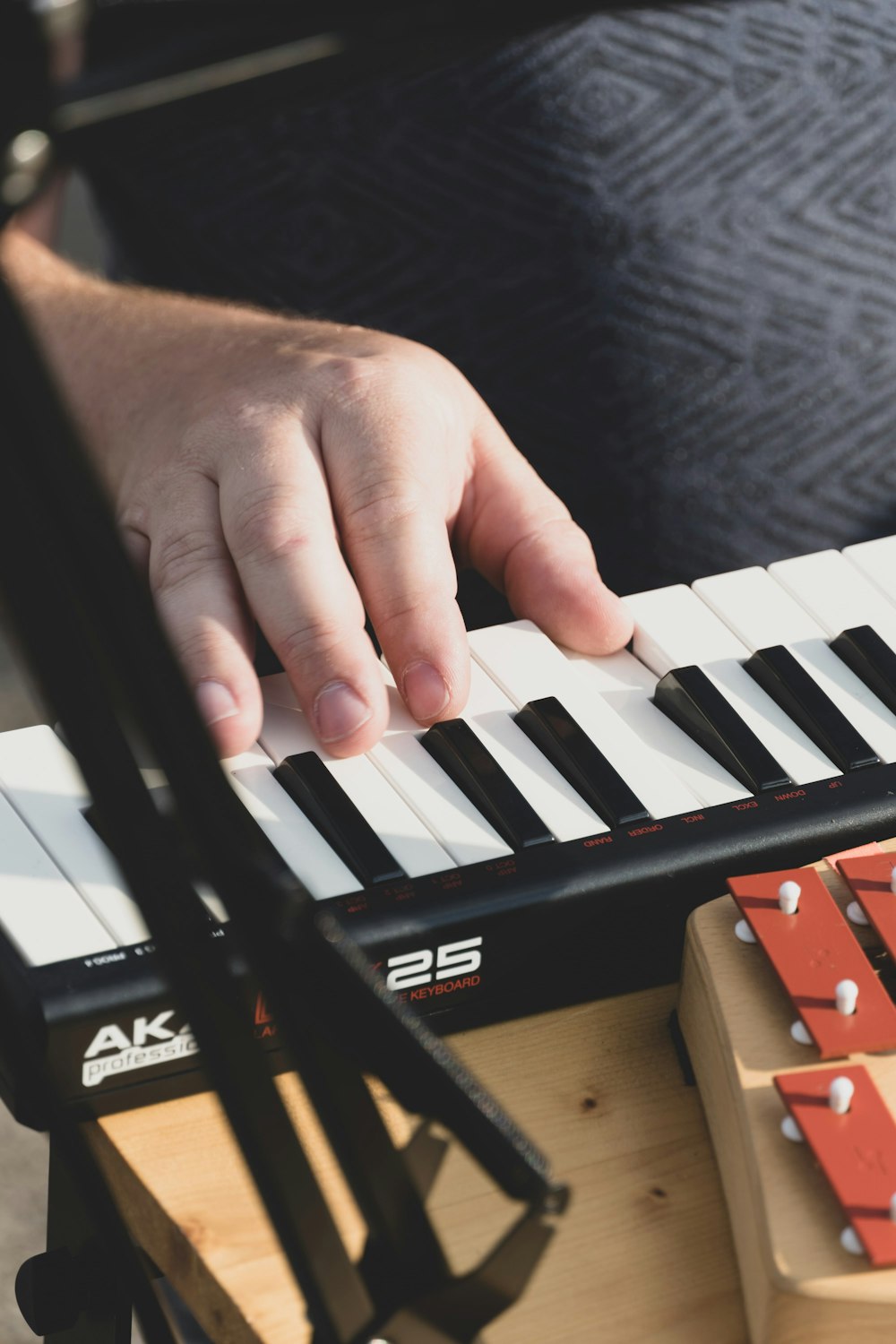 a person playing a piano with their hands