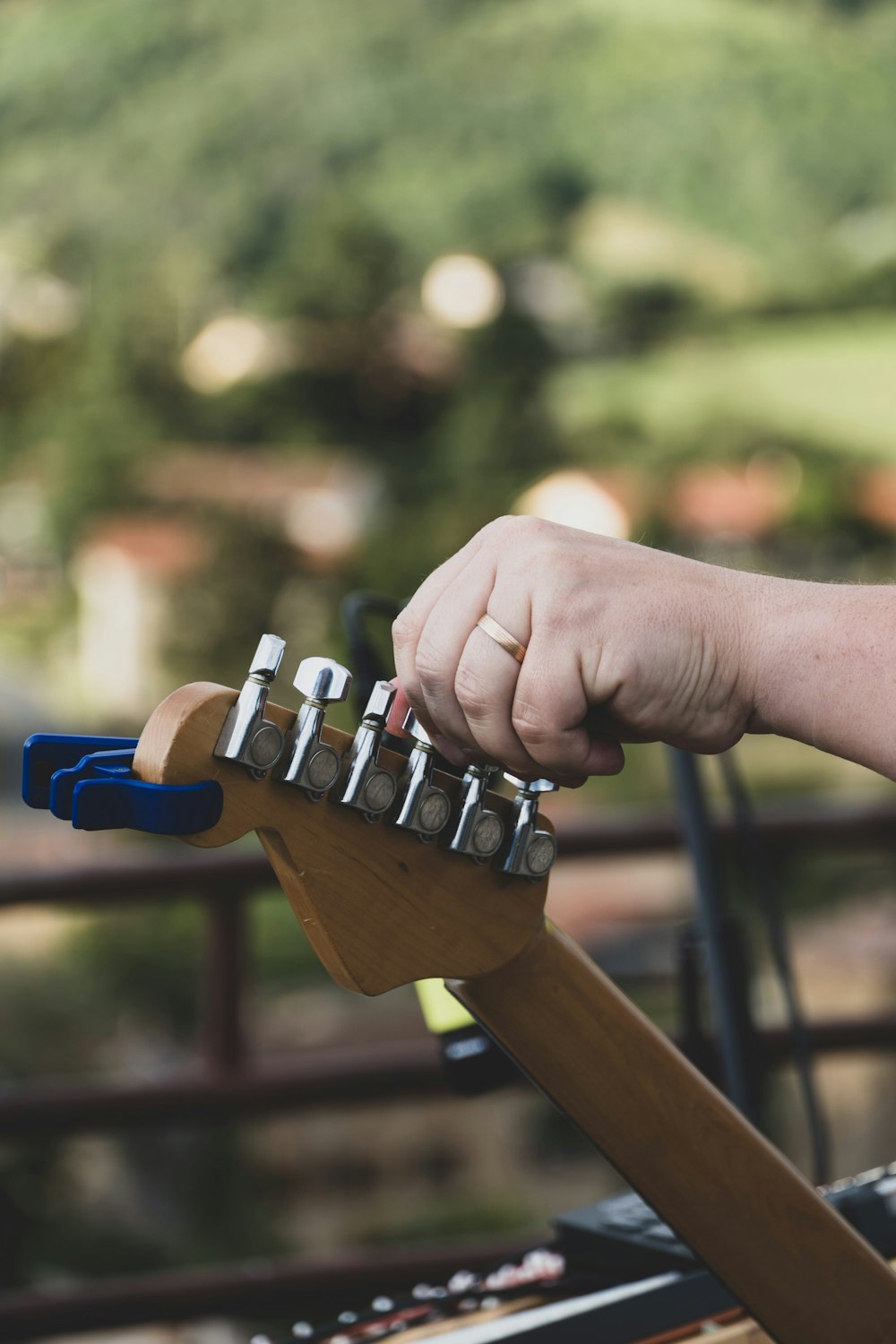 a person playing a musical instrument with a hand