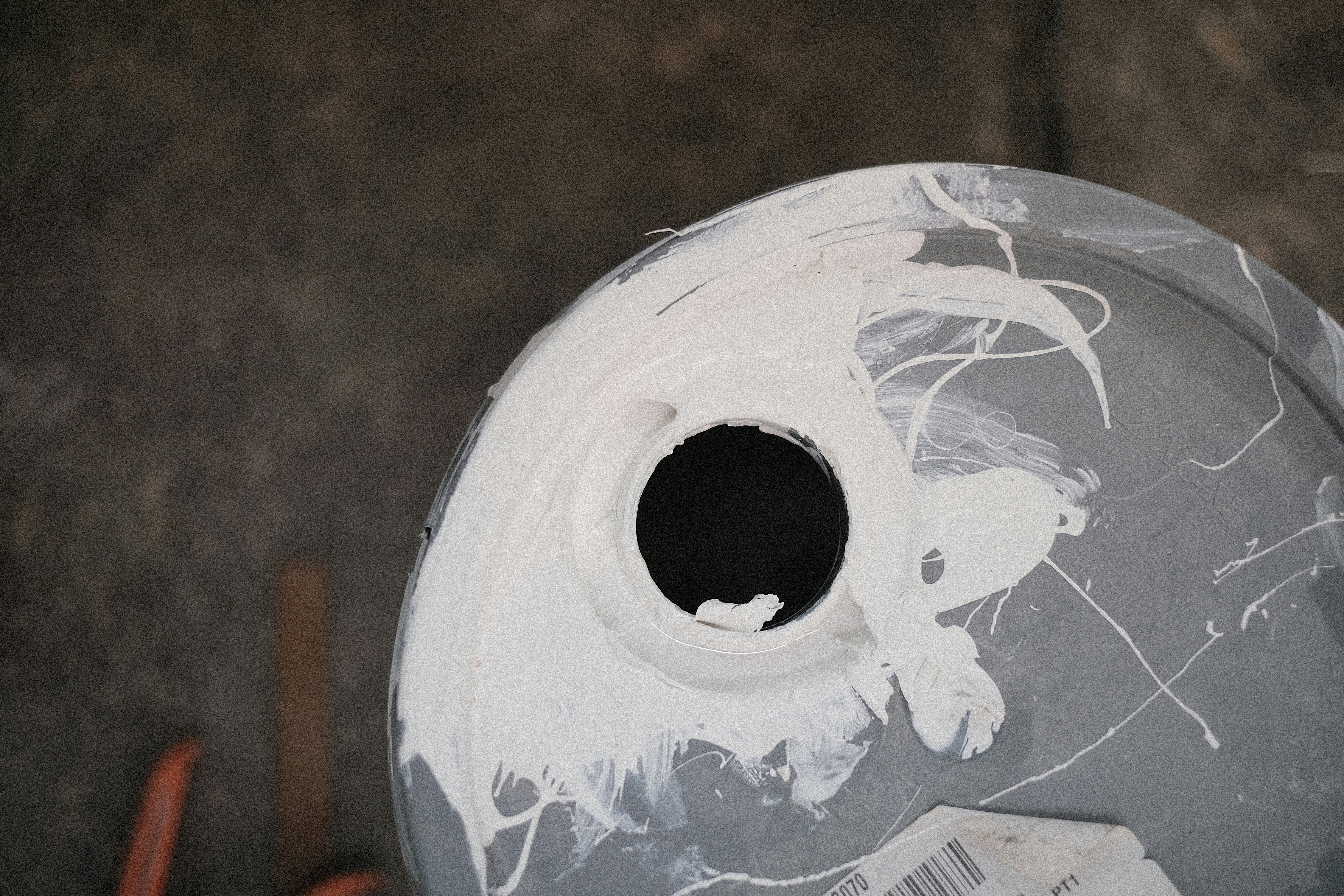 a close up of a white paint covered object