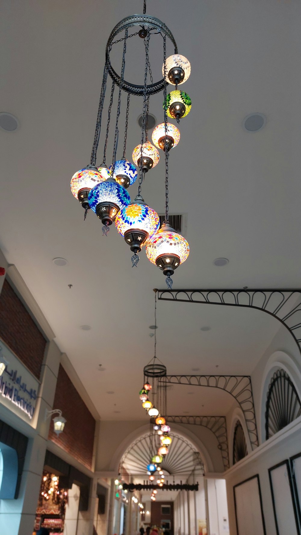 a chandelier hanging from the ceiling in a building