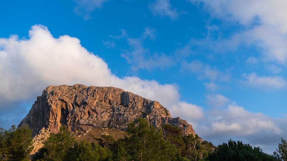 a mountain with a cloud in the sky