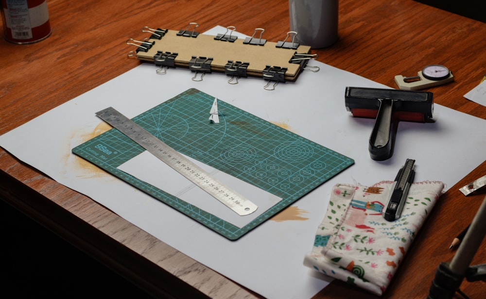 a wooden table topped with a cutting board and a pair of scissors