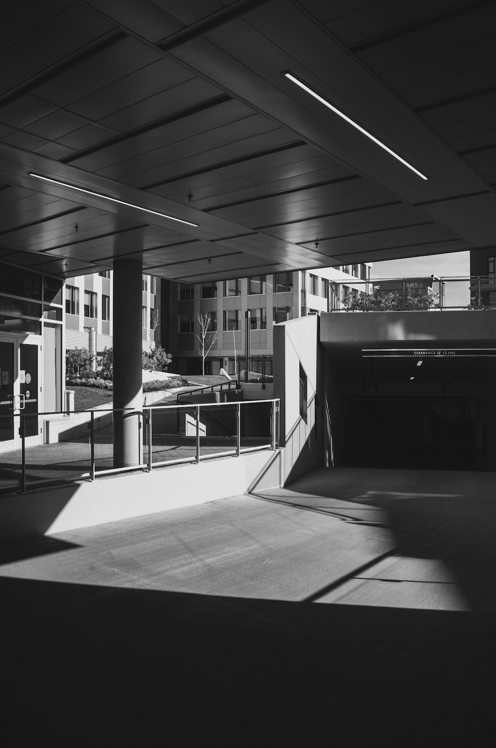 a black and white photo of a parking garage