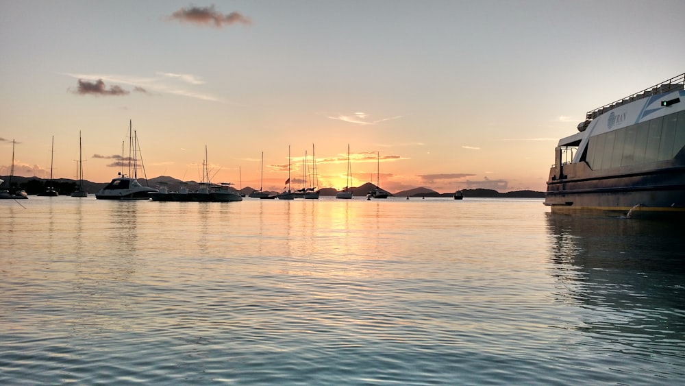 a group of boats floating on top of a body of water