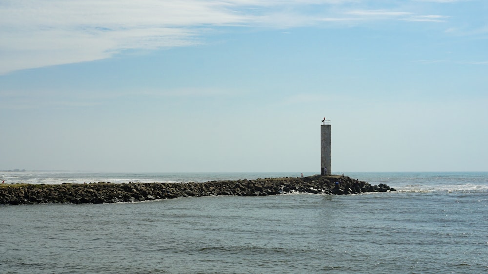 a light house sitting on top of a rock wall