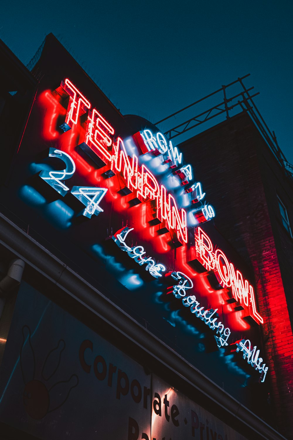 a neon sign on the side of a building