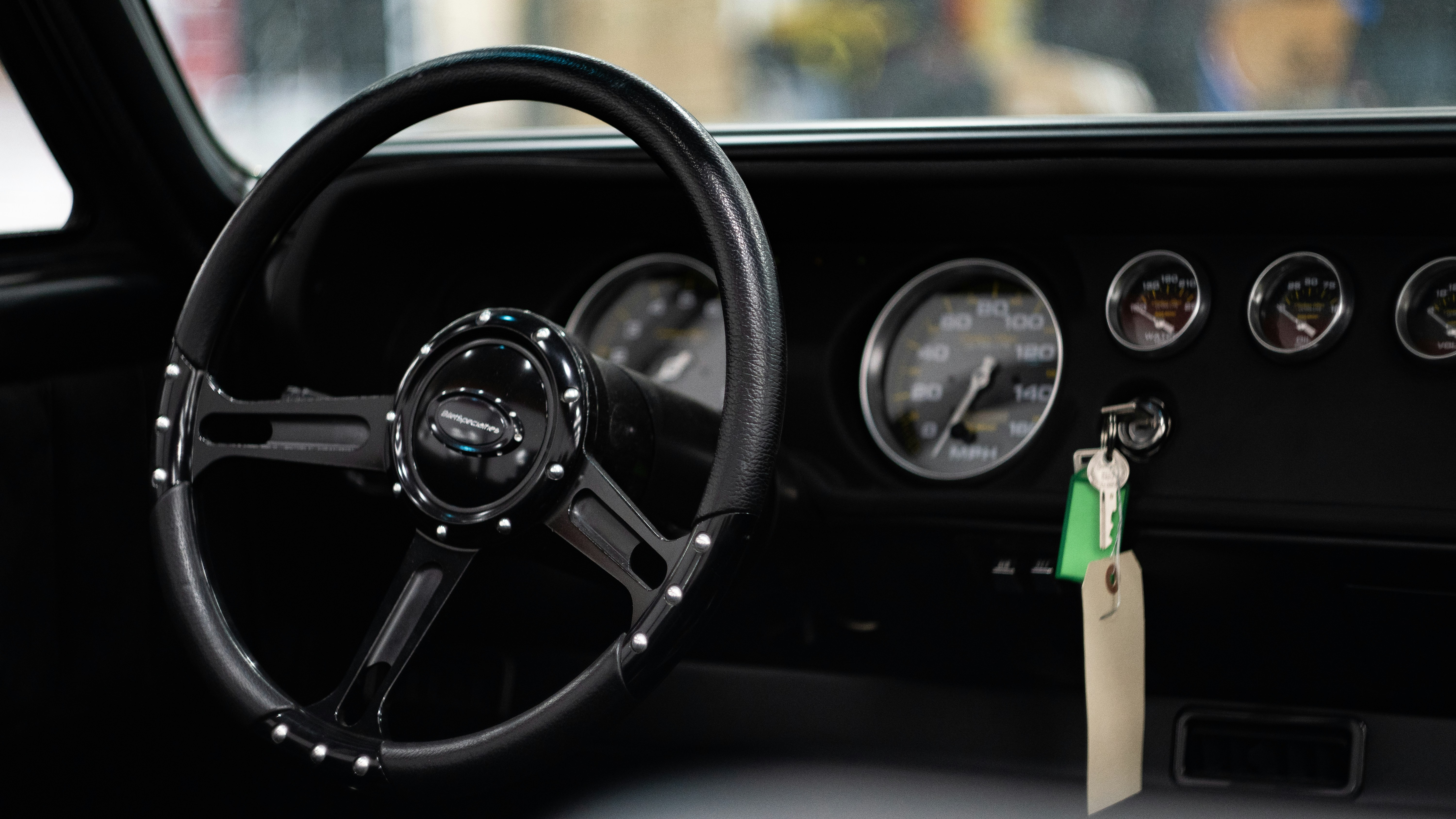 a steering wheel and dashboard of a car