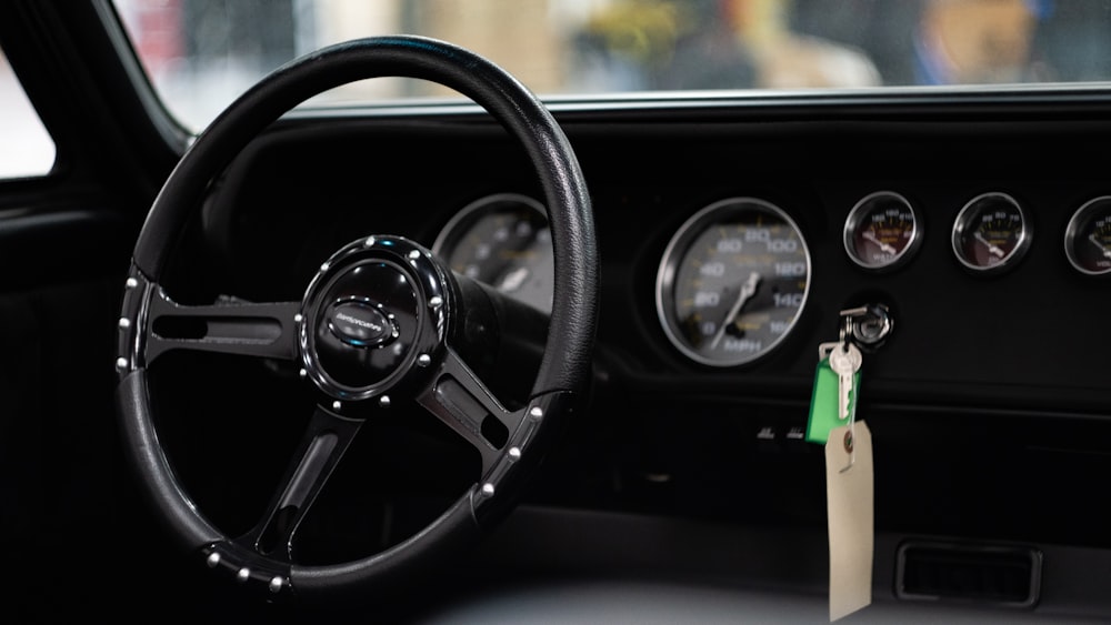 a steering wheel and dashboard of a car