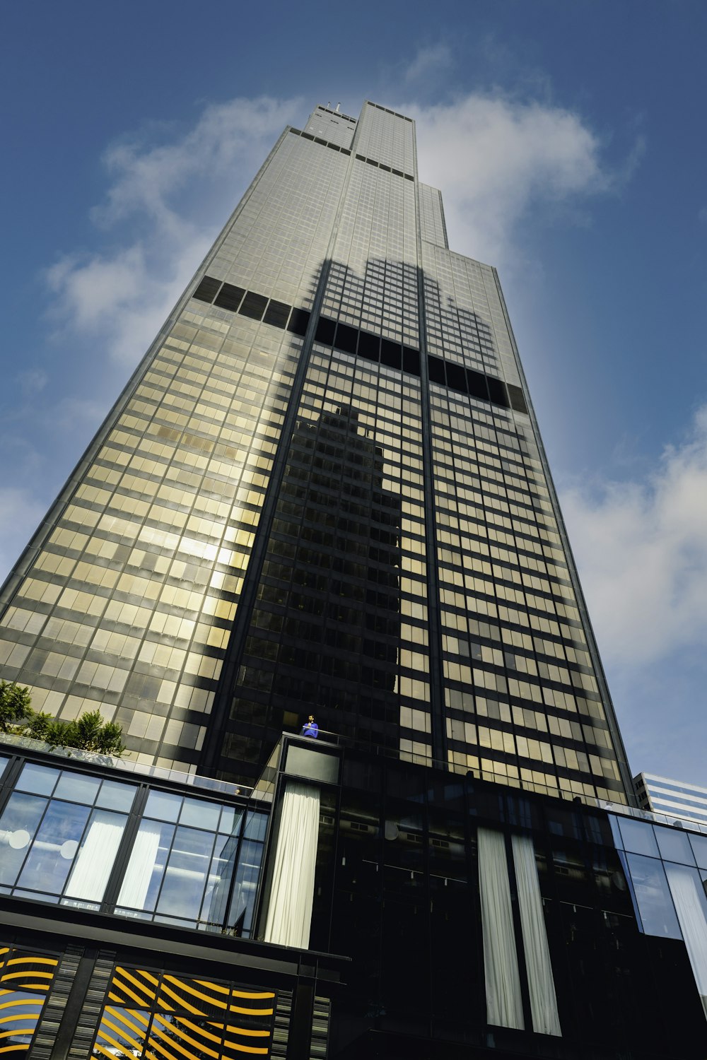 a very tall building with a sky background