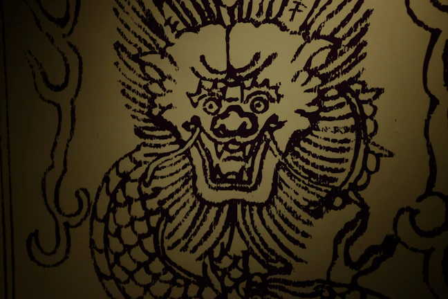 A majestic gold and black dragon swirling with mystical energy against a dark background.