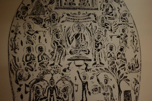 An intricate black-and-white sketch of various religious symbols arranged harmoniously on a clean white background.