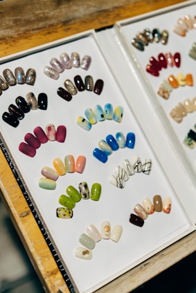 a couple of pictures of different colored nails