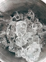 Industrial ice machine producing large quantities of ice cubes.