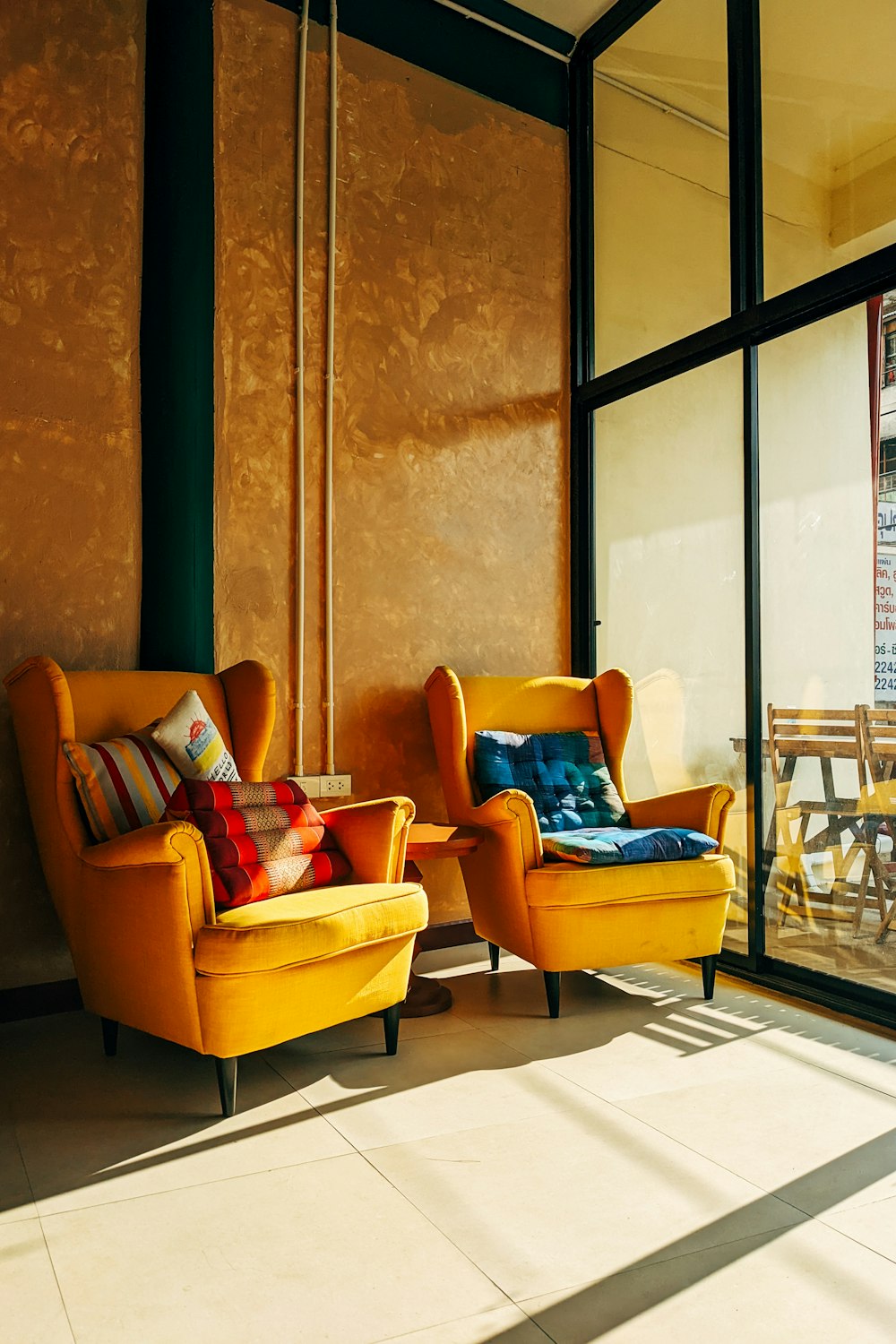 a couple of yellow chairs sitting next to each other