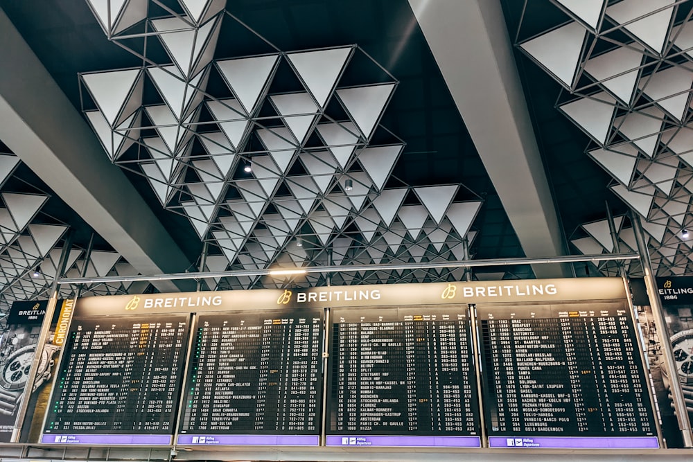 a large menu board in a train station