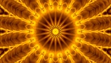 An intricate mandala pattern with a radial symmetry, featuring multiple triangular layers emanating from a central starburst design. The image is filled with rich golden hues, creating a sense of depth and texture. The repetitive arrangement of shapes gives a kaleidoscopic effect.