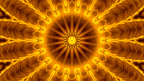 Detailed shot of golden dots forming a radiant mandala pattern on a dark green background.
