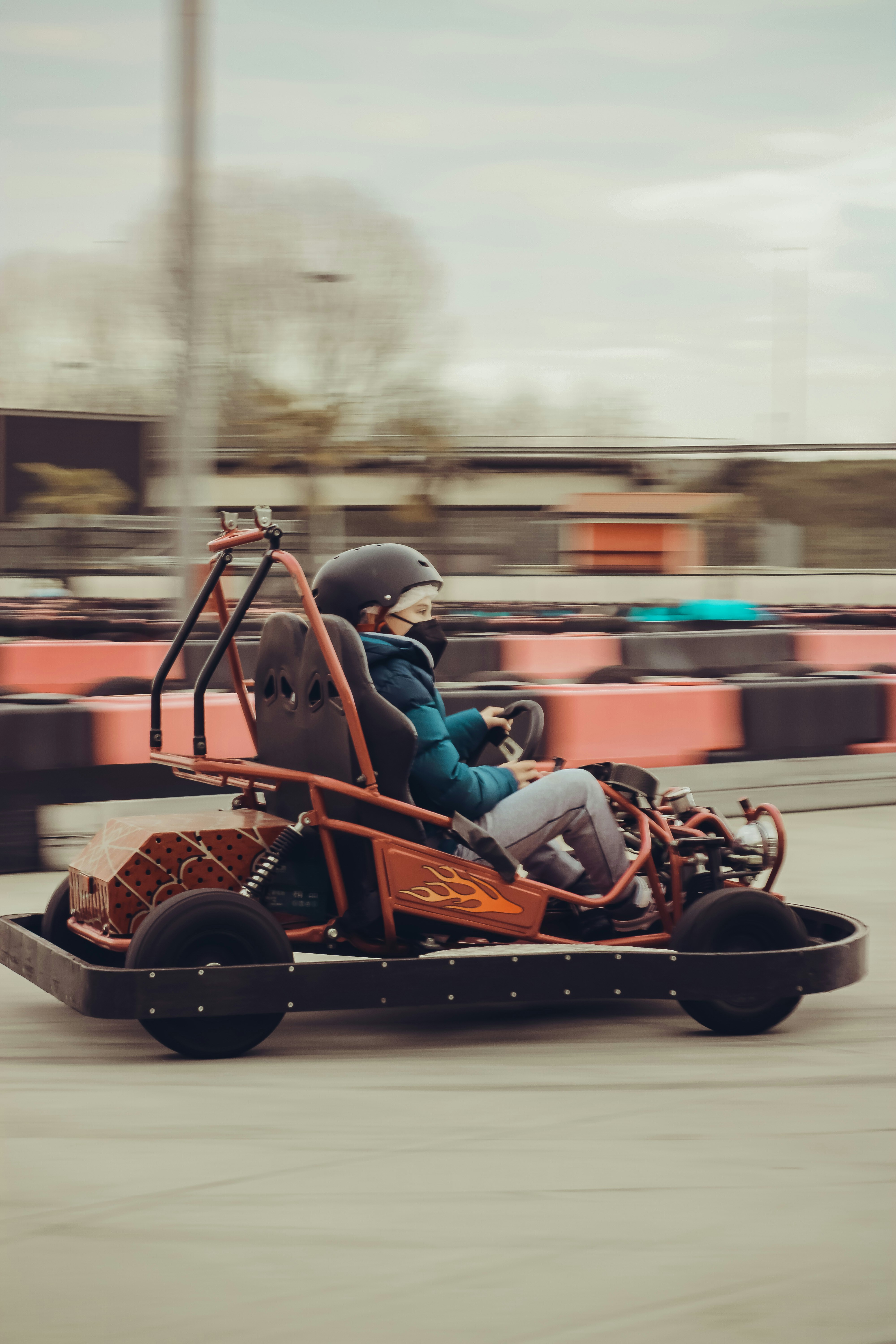 Person riding a go-kart on a track