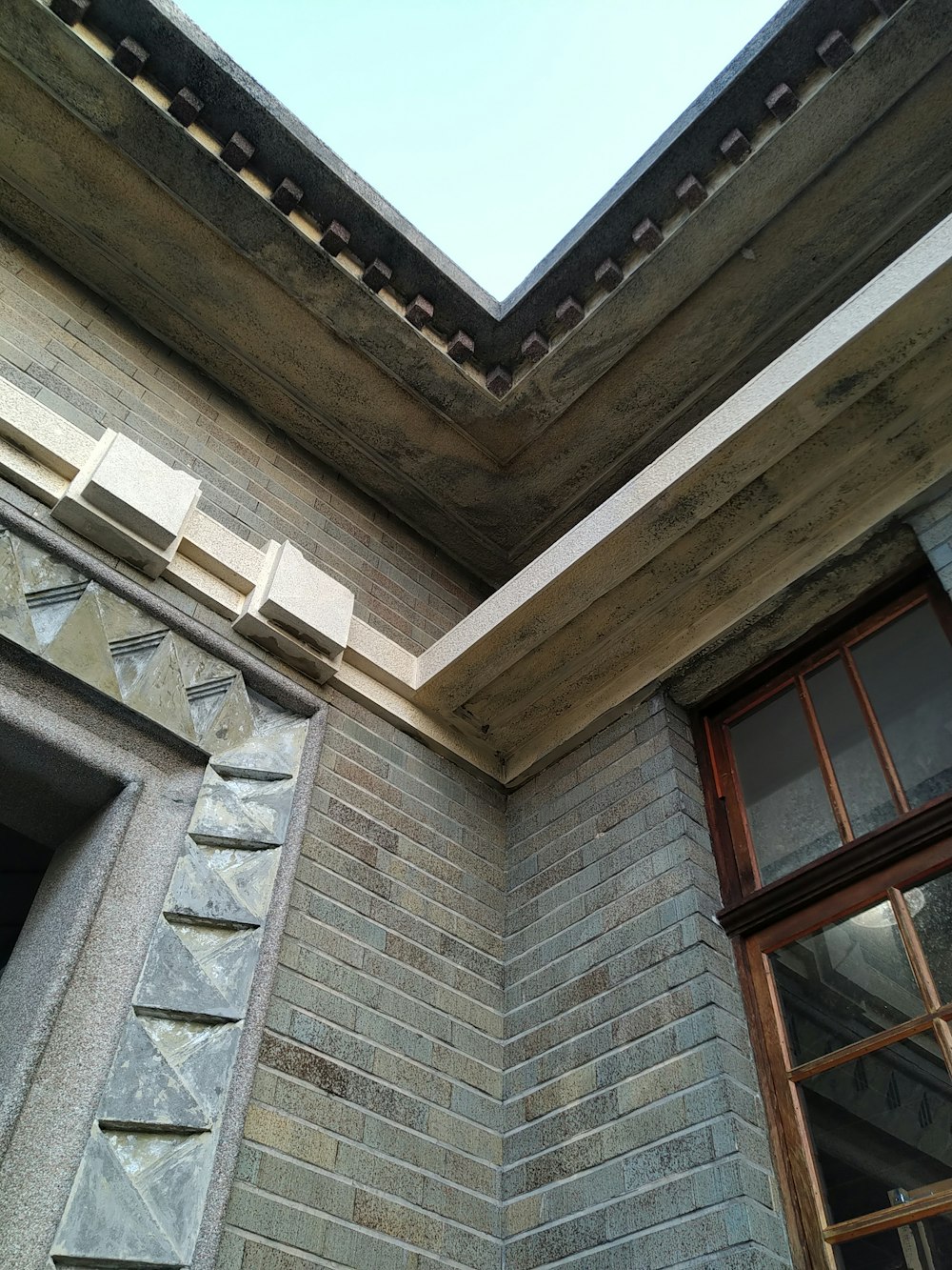 a close up of a brick building with a skylight