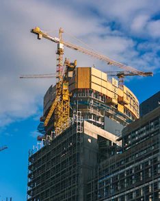 a crane is on top of a building under construction