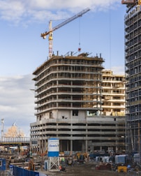 a building under construction with a crane in the background