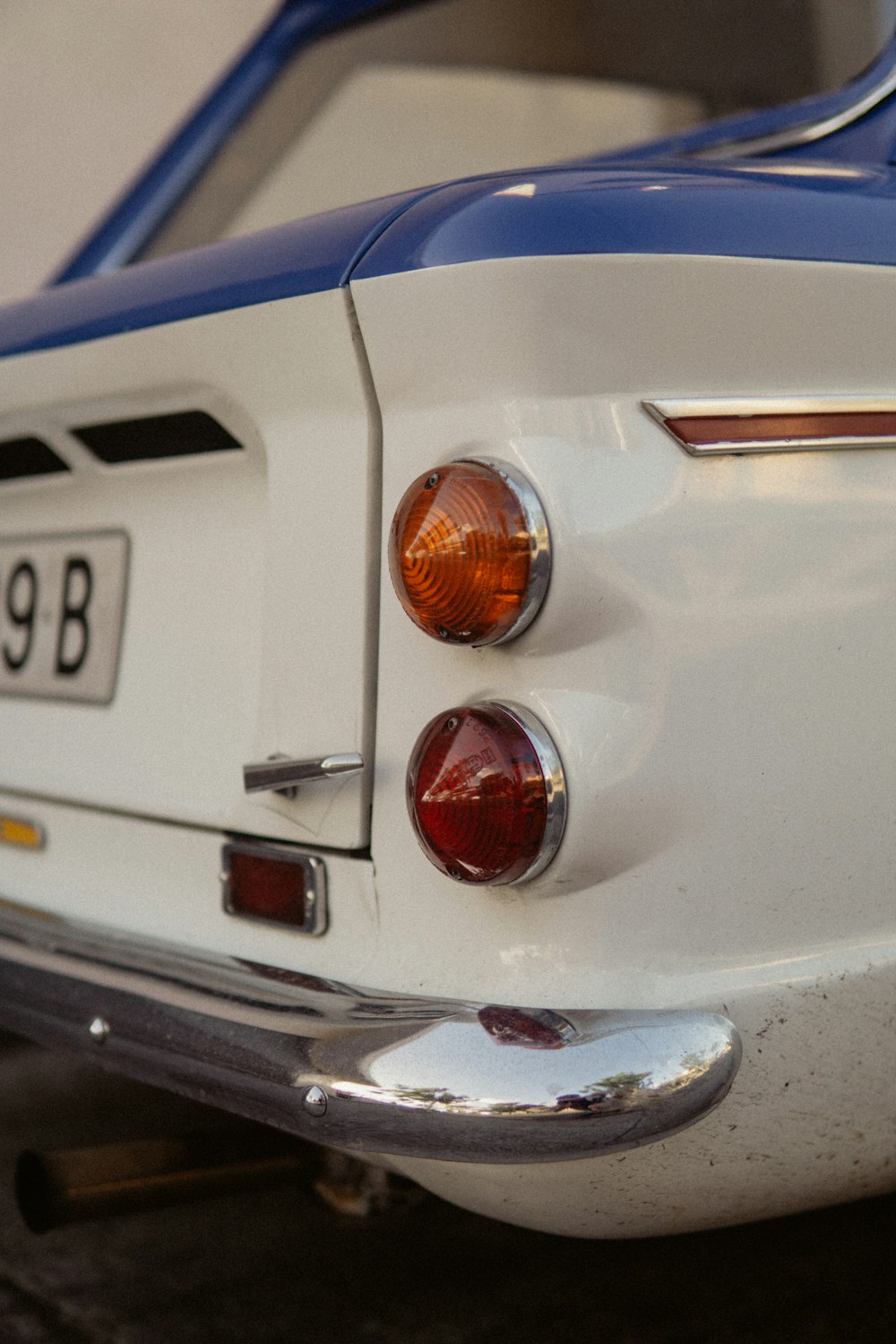 a close up of a white and blue sports car