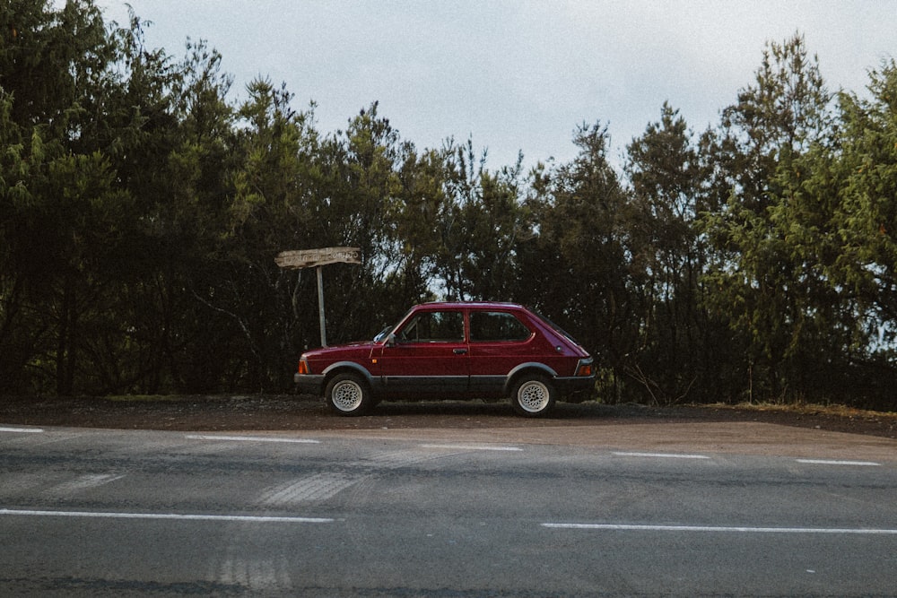 a red car parked on the side of the road