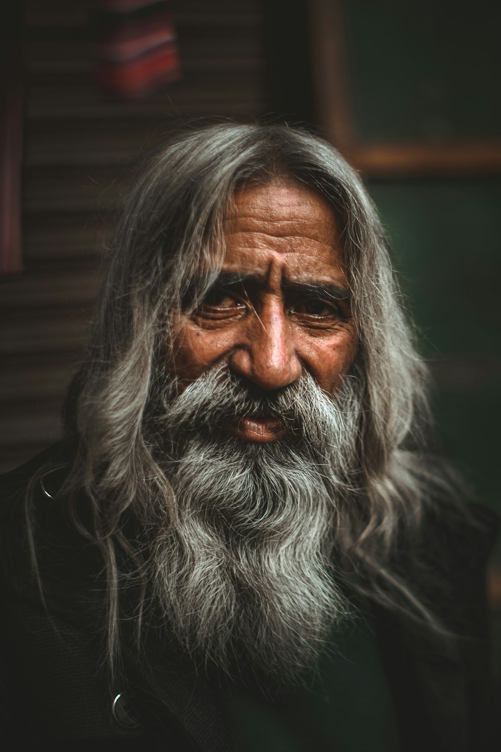 an old man with long grey hair and a beard