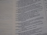 A close-up of a page from a text document with printed text in two columns, mainly on the right half of the page. The text is formatted in a question and answer style.