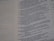 A close-up of a page from a text document with printed text in two columns, mainly on the right half of the page. The text is formatted in a question and answer style.