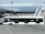 An airport scene featuring a large commercial airplane on the tarmac. A passenger stairs vehicle is attached to the plane, with a person standing near the top of the stairs. In the foreground, an airport bus labeled 'Cobus 3000' and 'IranAir' is parked parallel to the airplane.