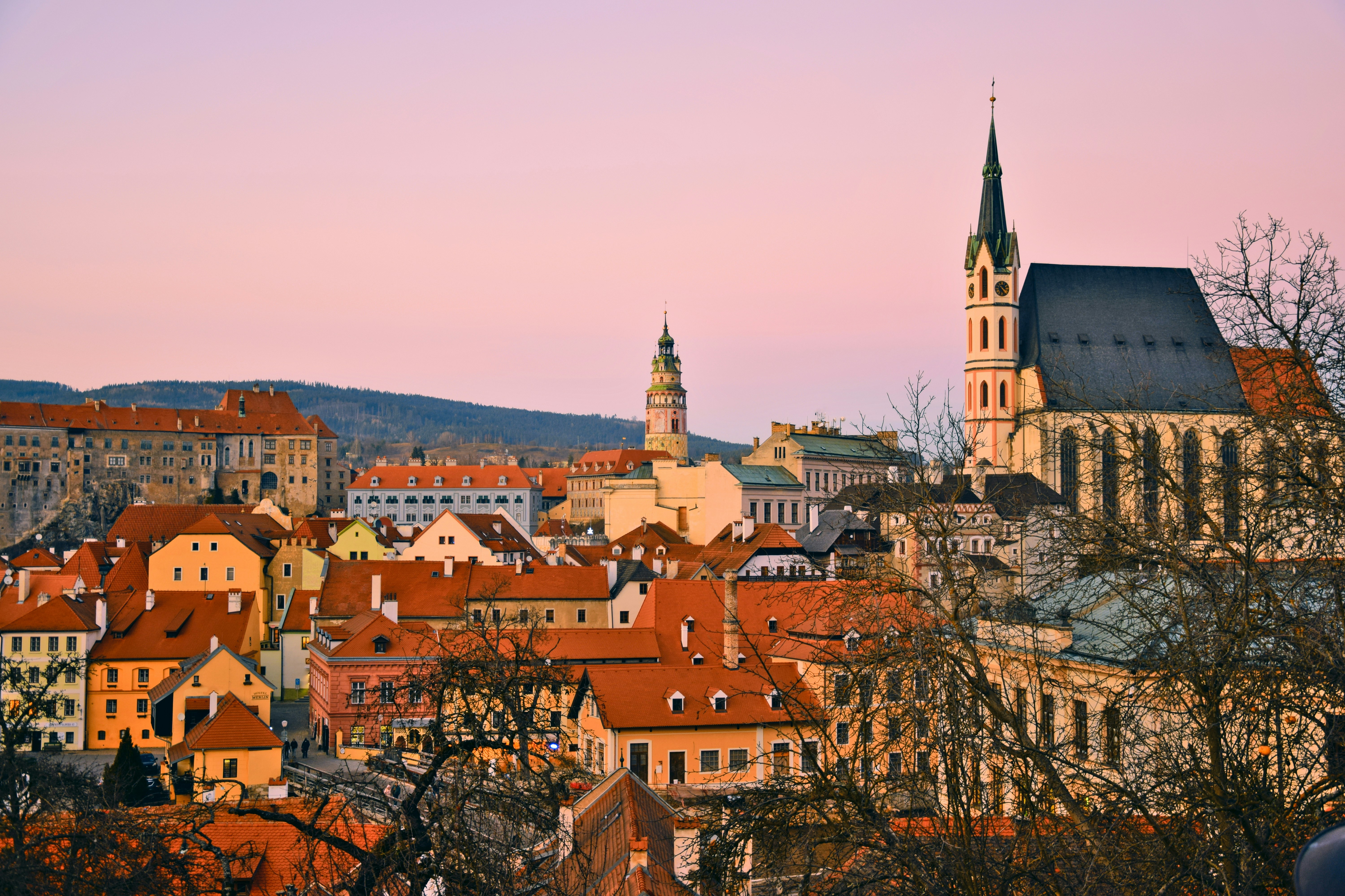 a view of a city with a church steeple in the background