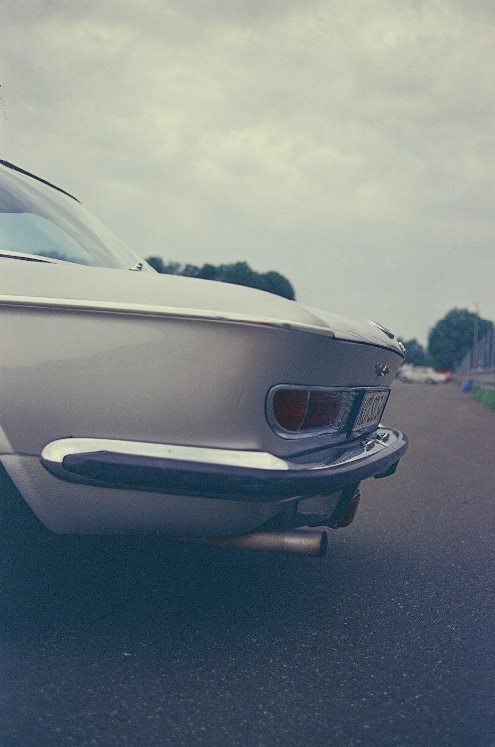 a white car parked on the side of the road