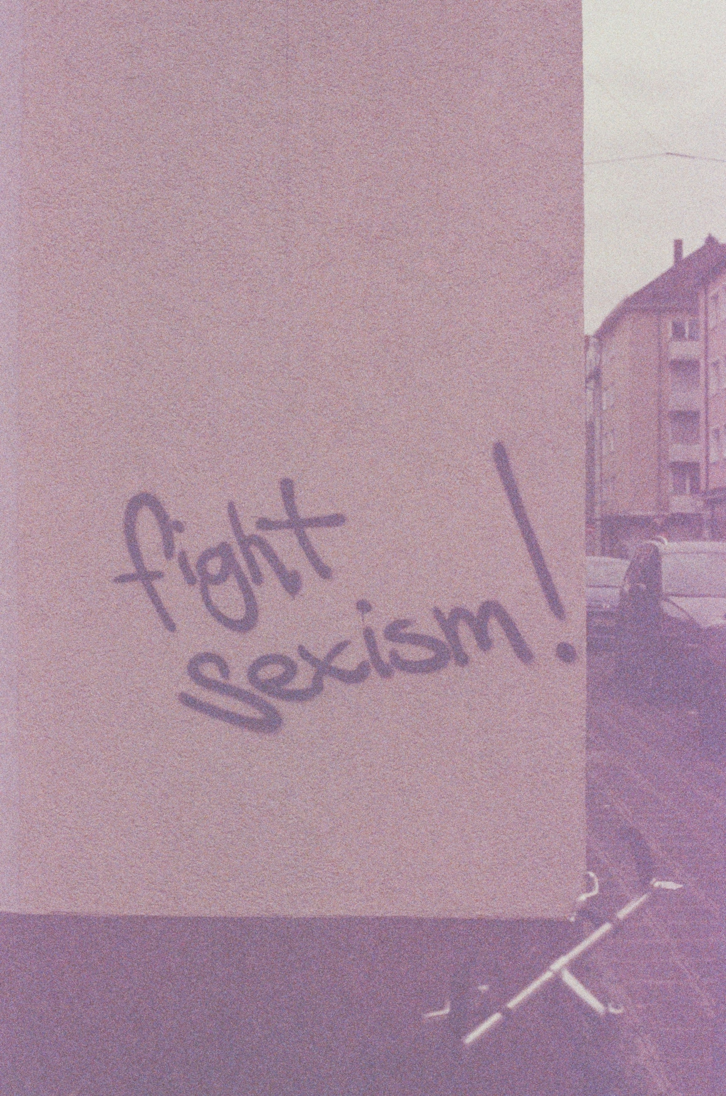 a sign that says fight sexism on it