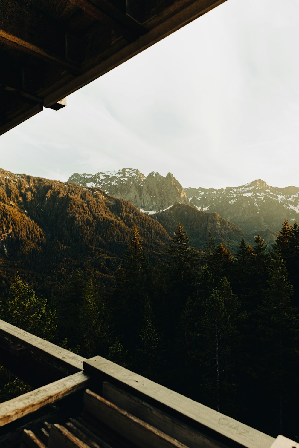 a view of a mountain range from a porch