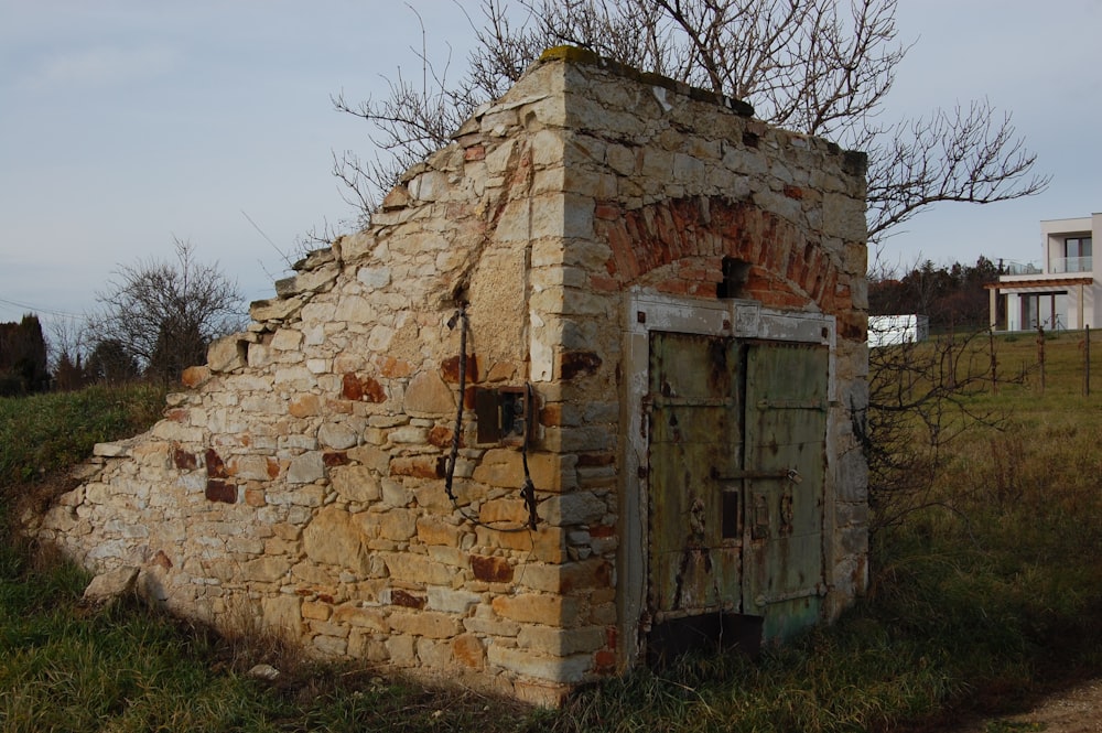 an old outhouse made of bricks and stone