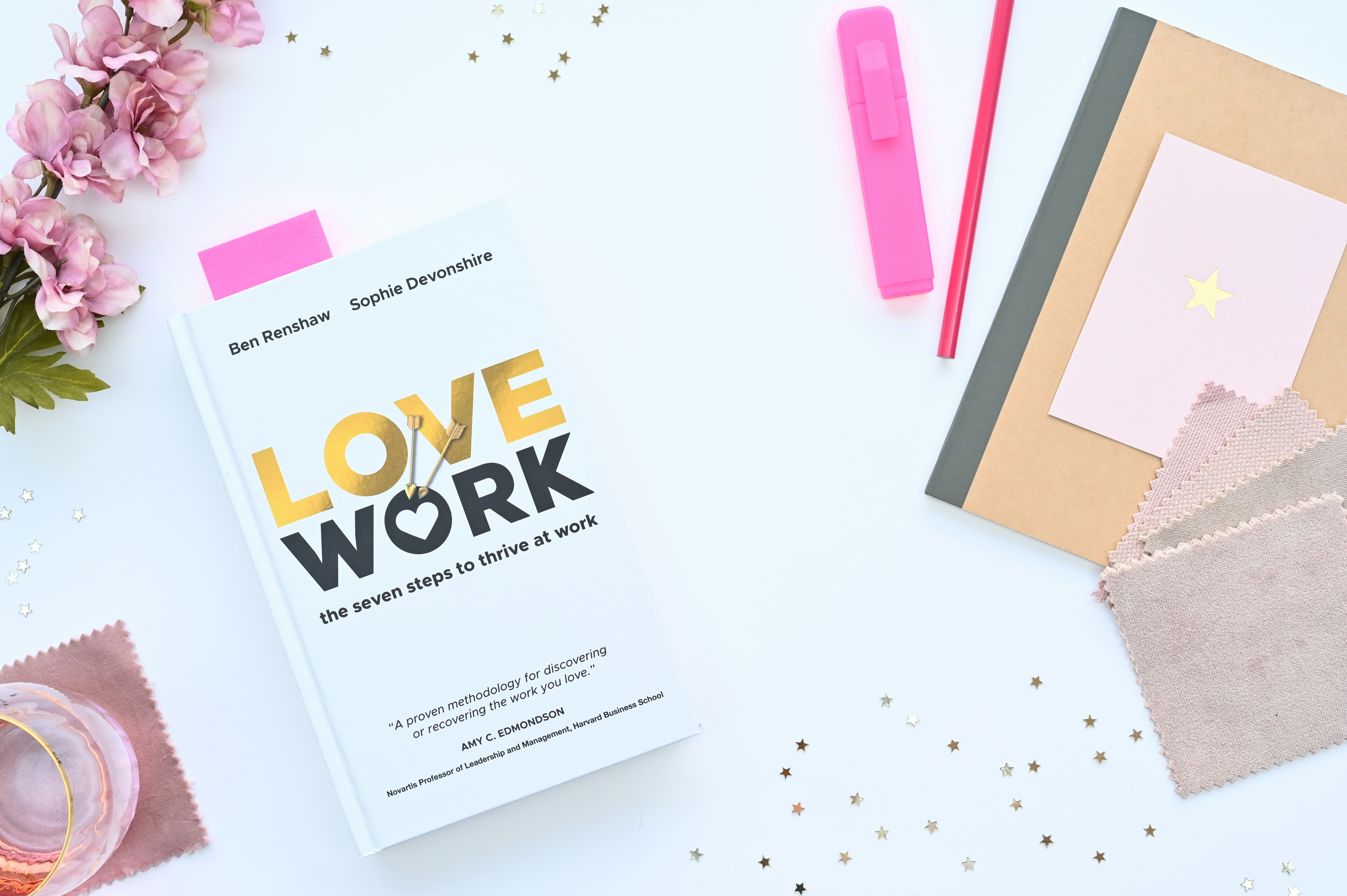 a book sitting on top of a white table, Ben Renshaw and Sophie Devonshire believe it’s possible to make the time you spend at work more rewarding and enjoyable. In LoveWork they share seven simple steps to help you find new ways to build a more positive relationship with your work.