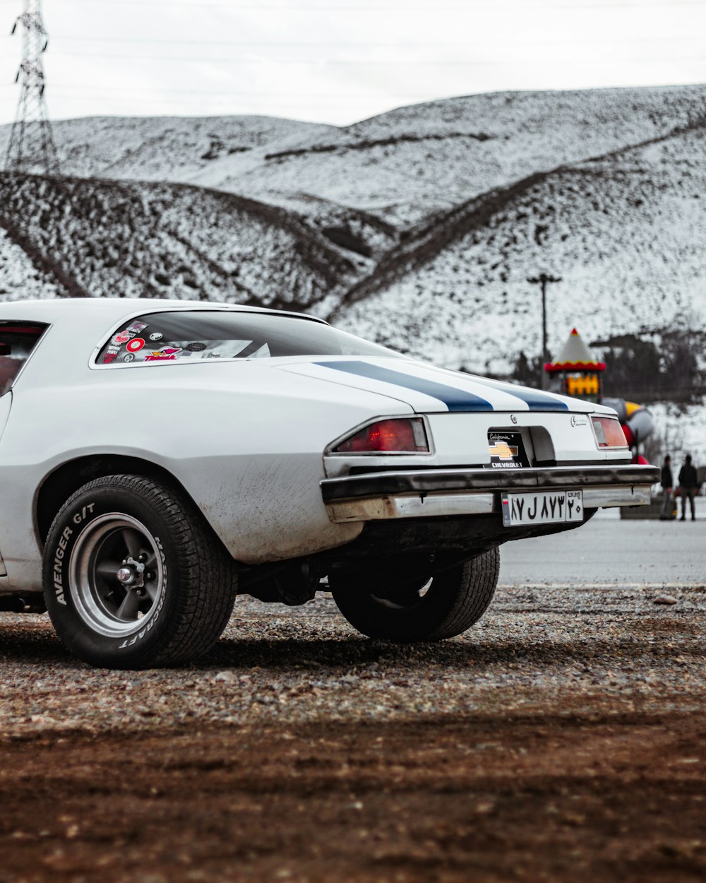 a white car parked on the side of the road