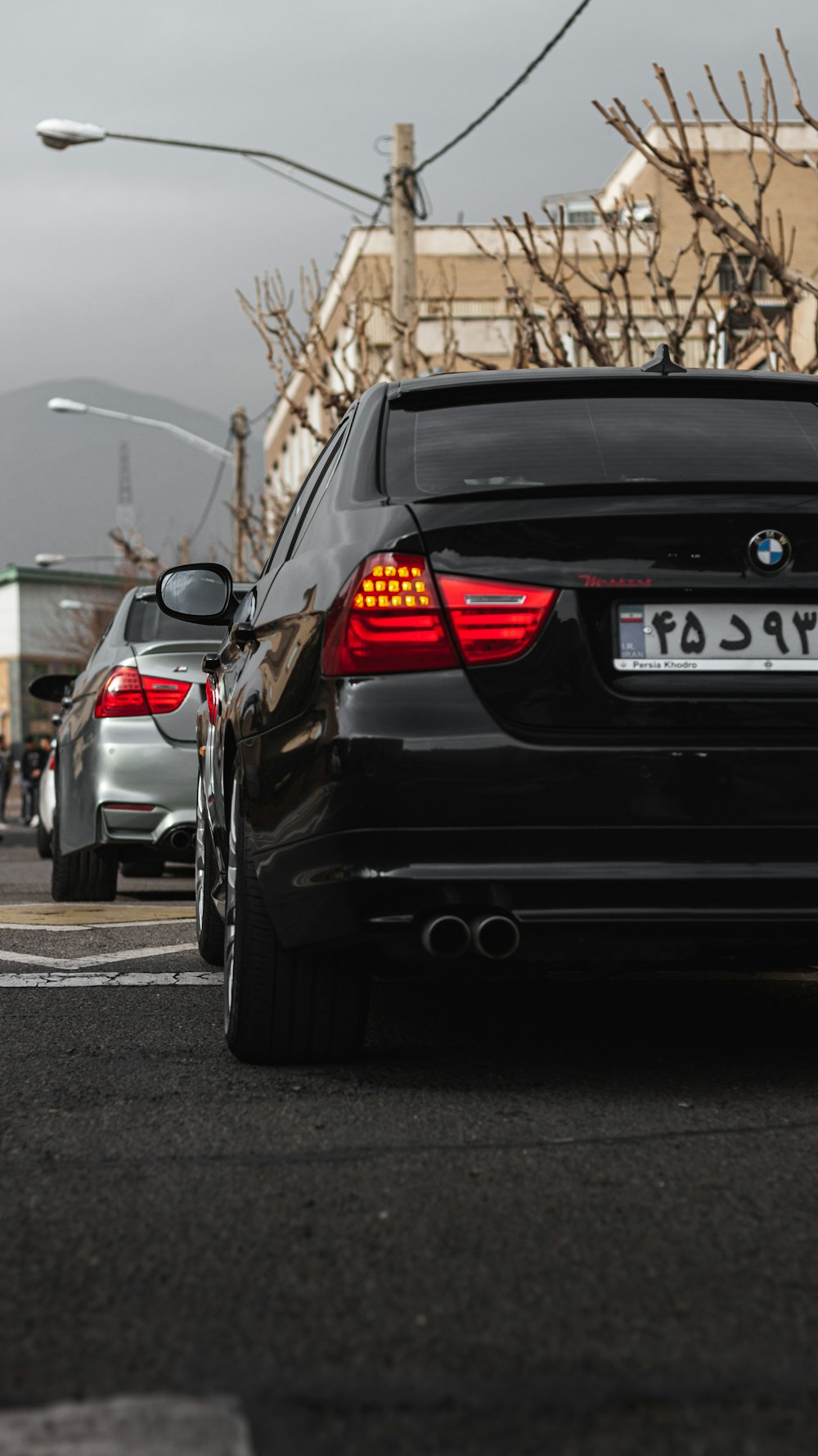 a black car parked on the side of the road