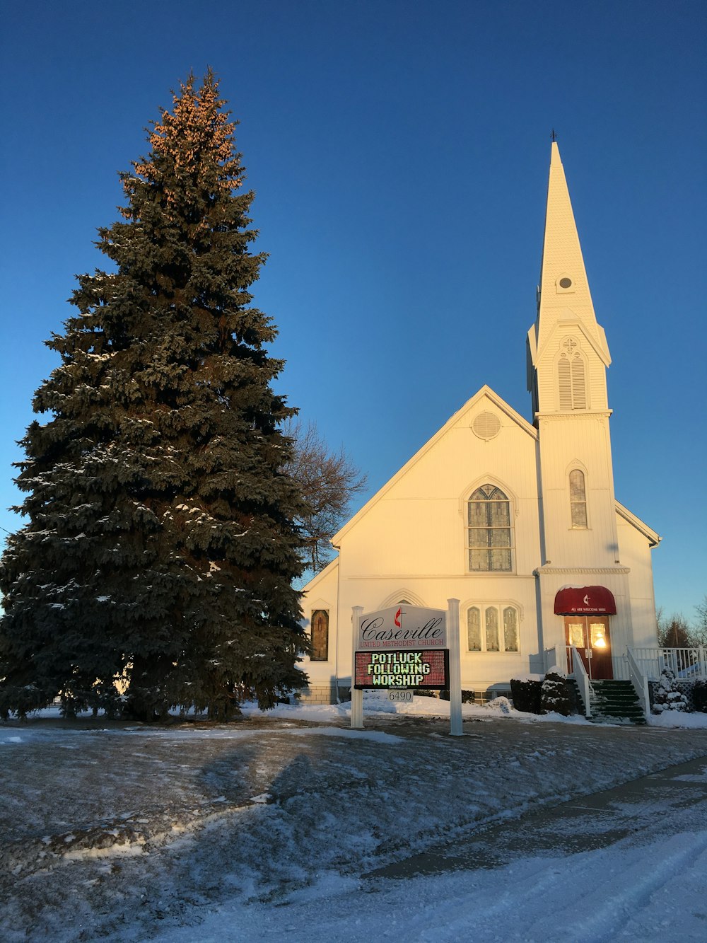 a church with a sign in front of it