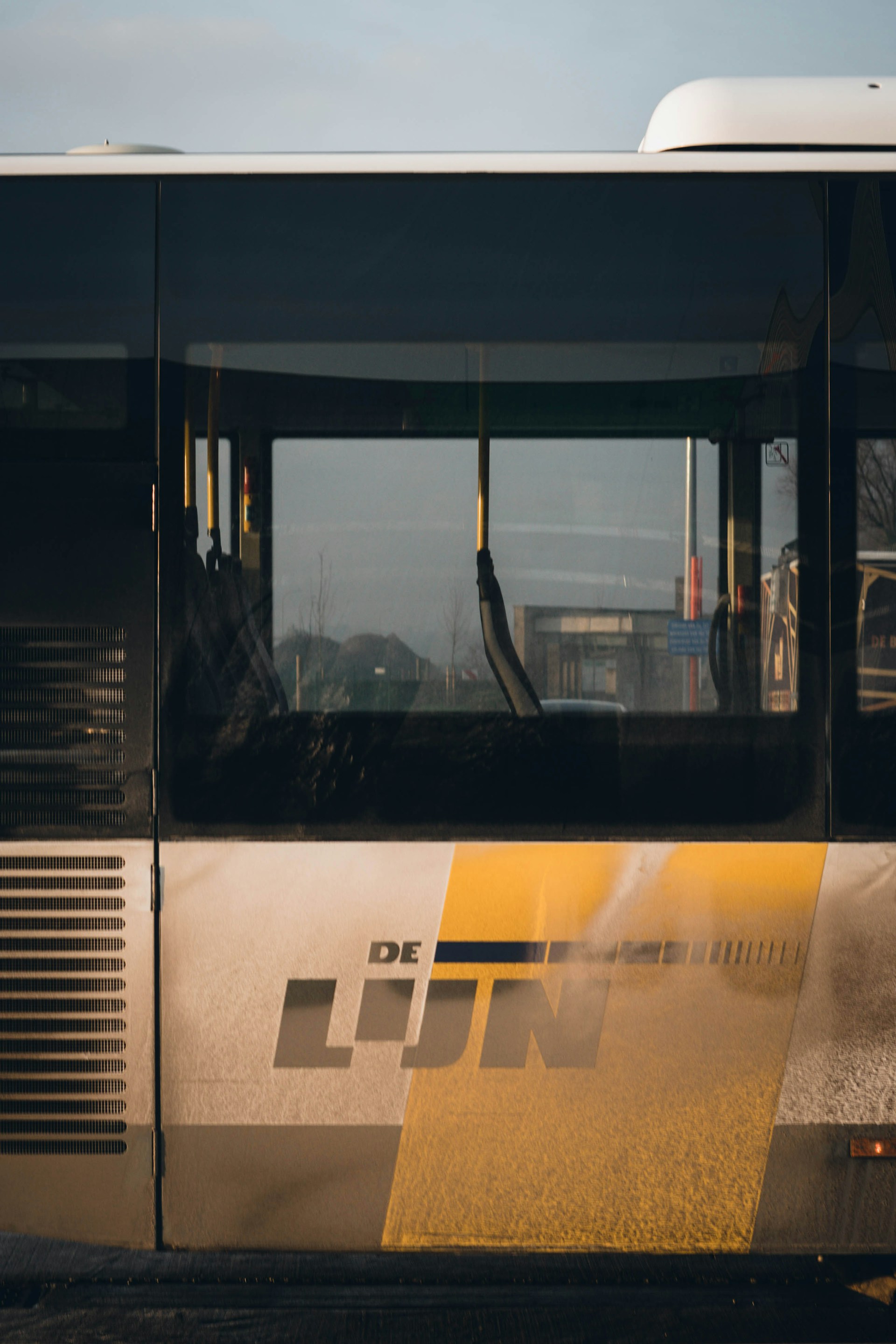 woman wearing yellow long-sleeved dress under white clouds and blue sky during daytime