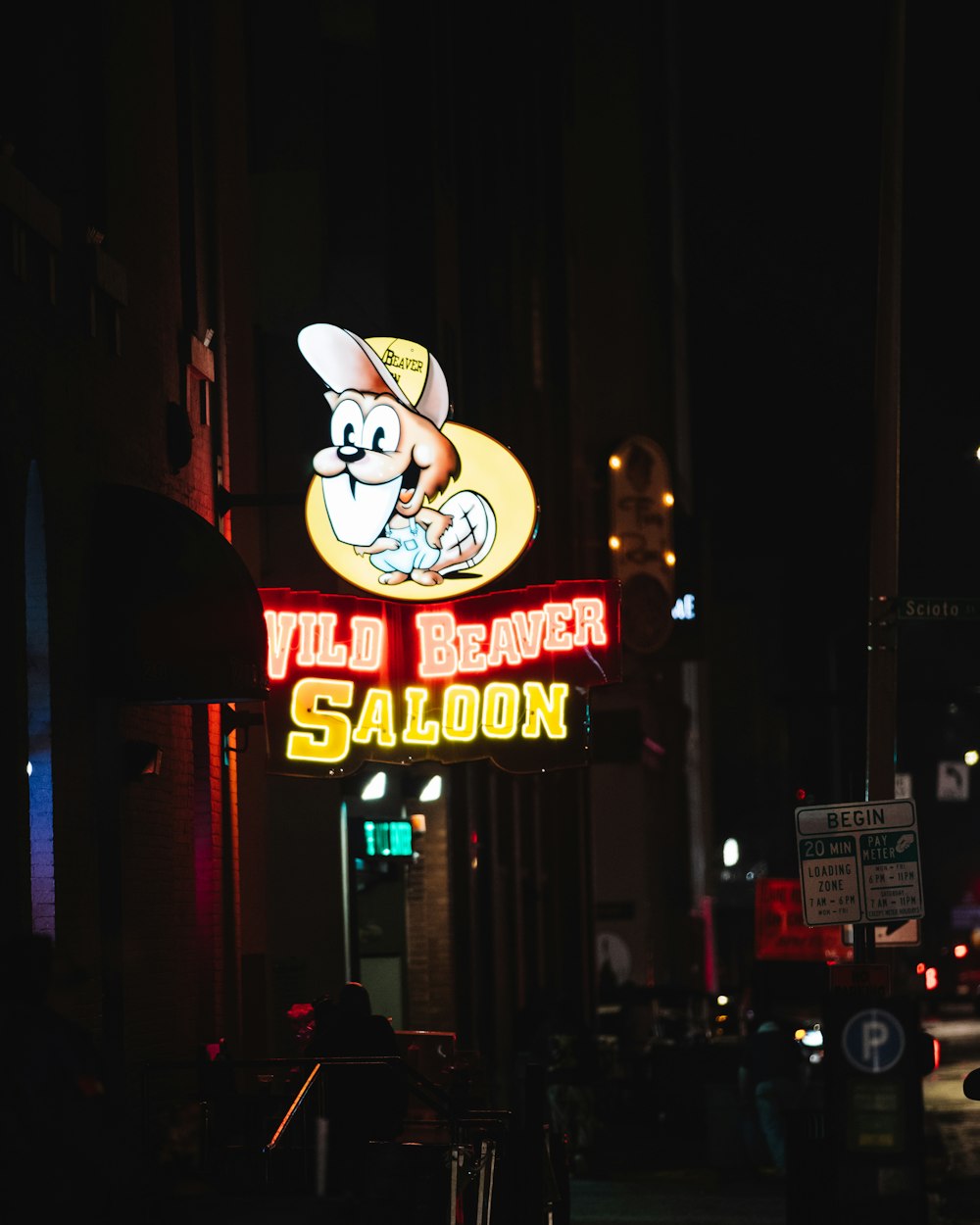 a neon sign on the side of a building