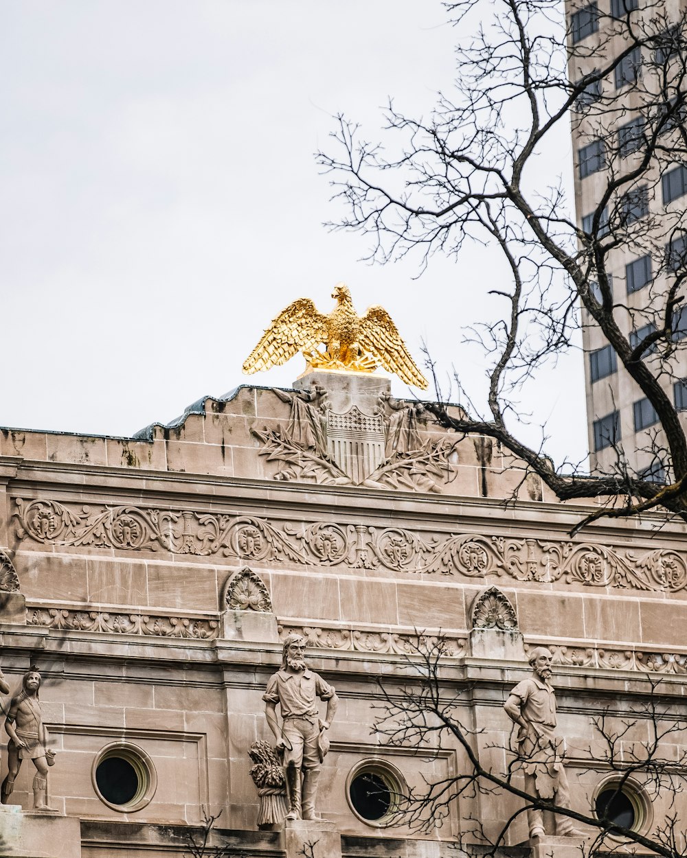 a building with a golden eagle on top of it