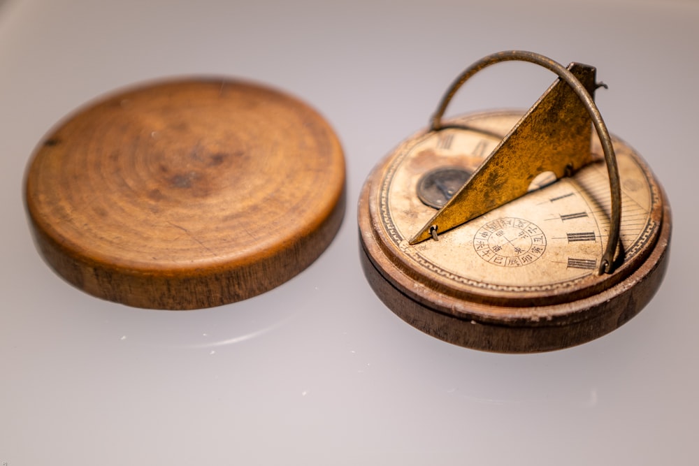 an old pocket watch with a wooden case