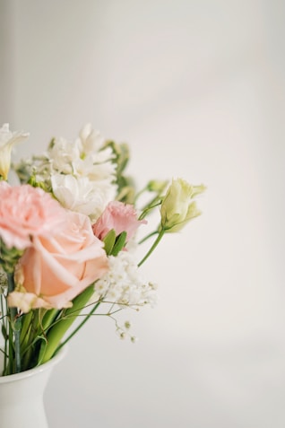 A delicate floral arrangement with soft pastel colors, symbolizing love and celebration.